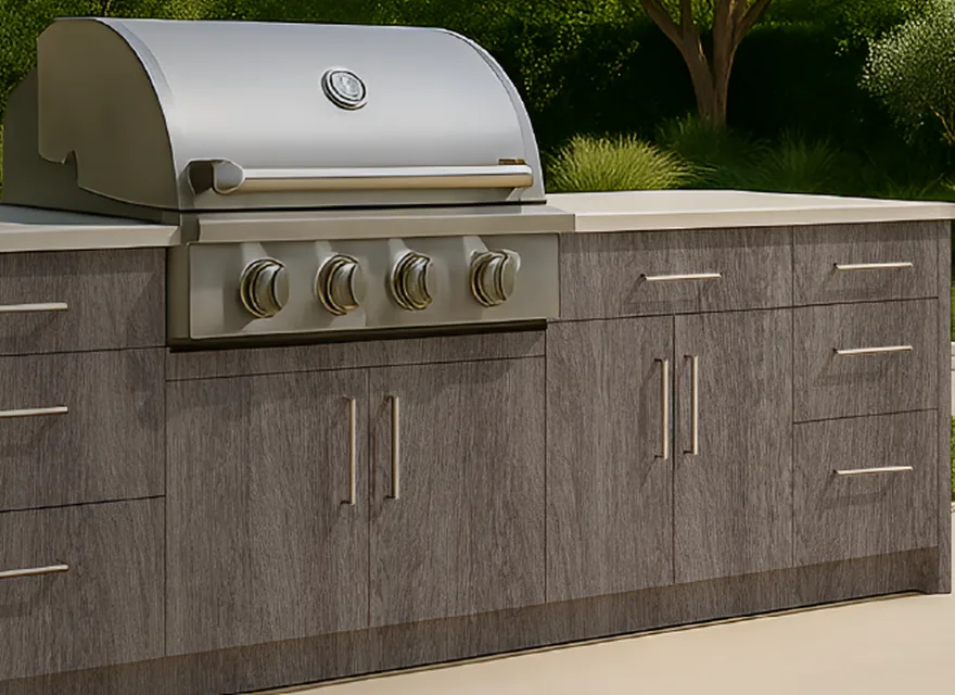 Close view of outdoor cabinet fronts, grill planning, slab doors, and stainless pulls.